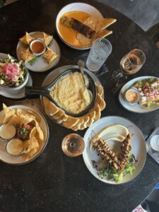 multiple shared plates/food items on a table