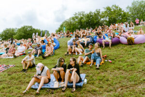 people sit on hill at Hinterland